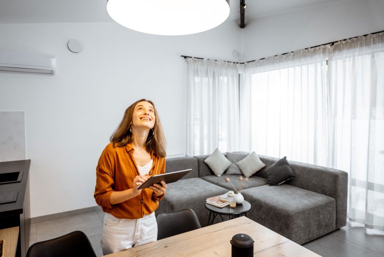 woman controlling light with a digital tablet at h 2025 03 31 08 59 01 web
